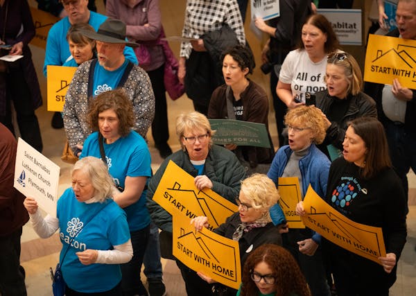 Affordable housing advocates gathered in the rotunda inside the State Capitol in St. Paul on Tuesday.