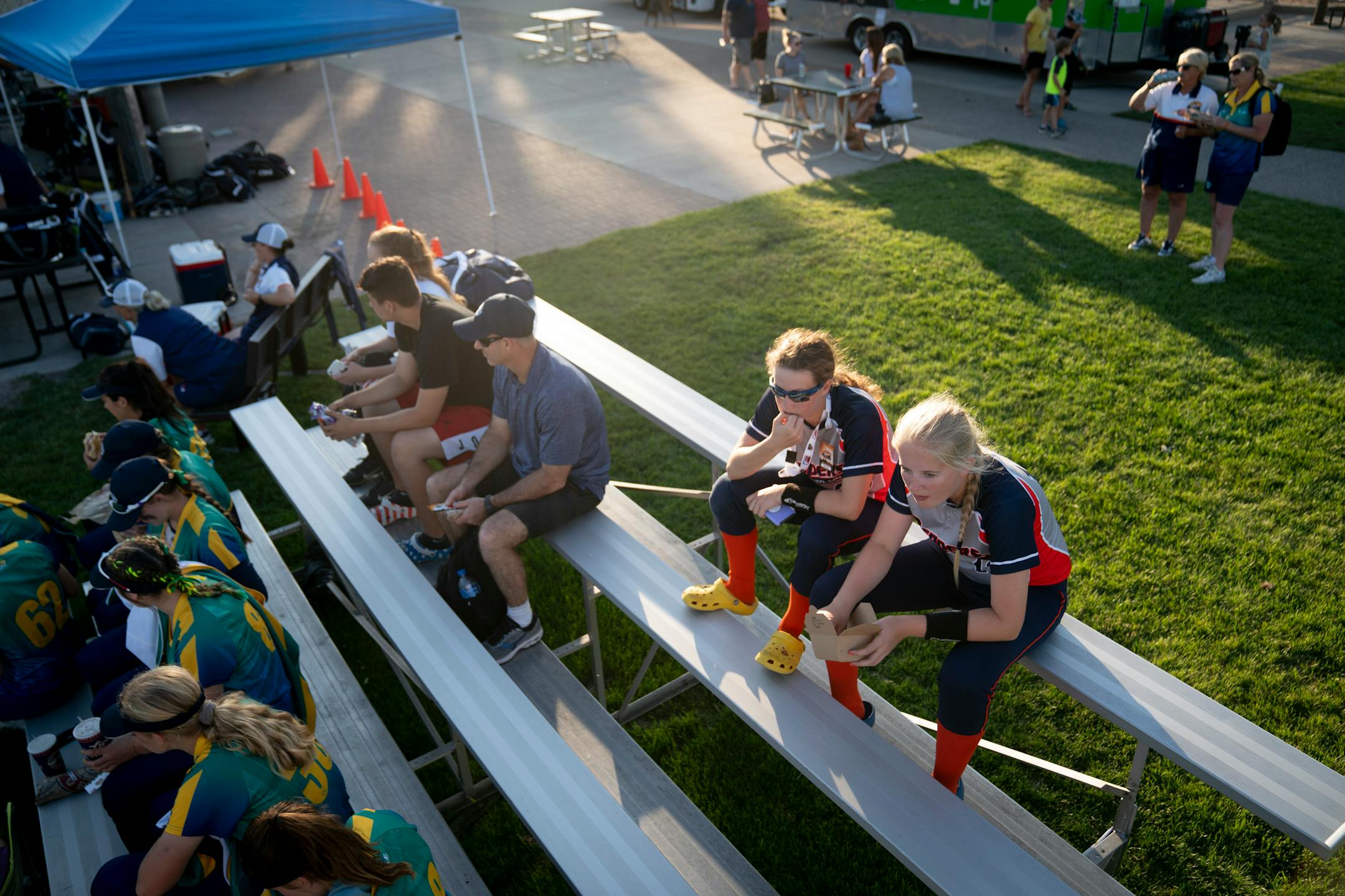 Avery Schuh and Hailey Petzel, both youth Peppers softball players, watch the Aussie Pepper's play the Canadian Wild in North Mankato, Minn. Wednesday, July 3, 2019. ] RENEE JONES SCHNEIDER ¥ renee.jones@startribune.com