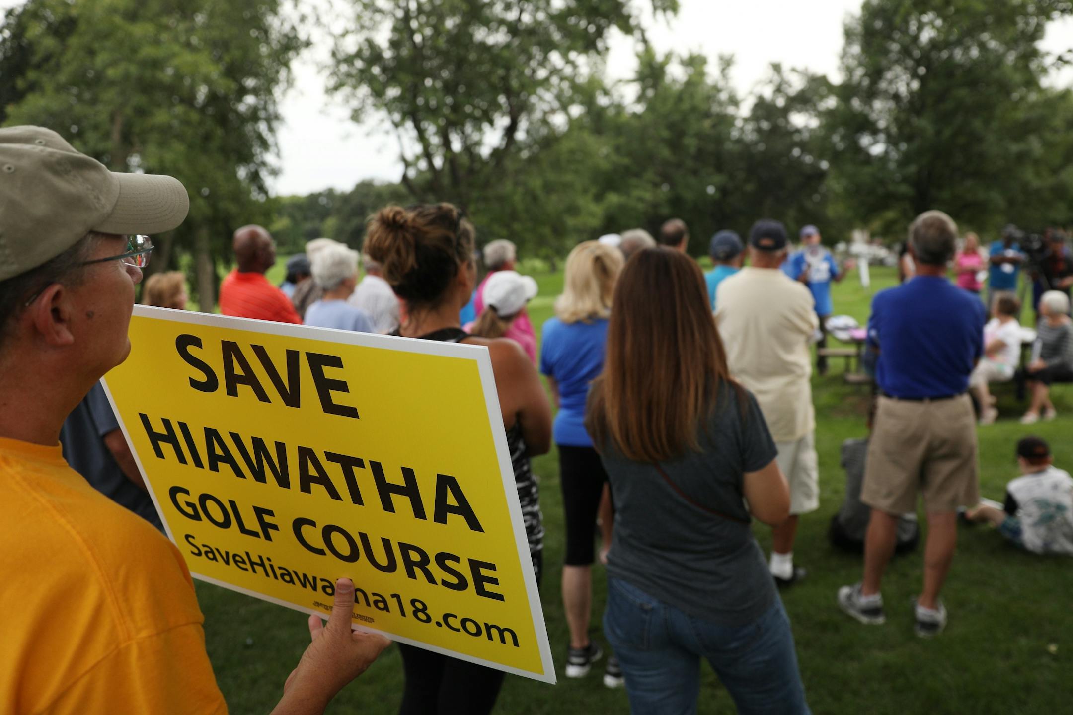 Golfers and supporters of the Hiawatha Golf Course held signs as they rallied against the Park Board's recent decision to reduce pumping and close the course at the end of 2019 season Tuesday.