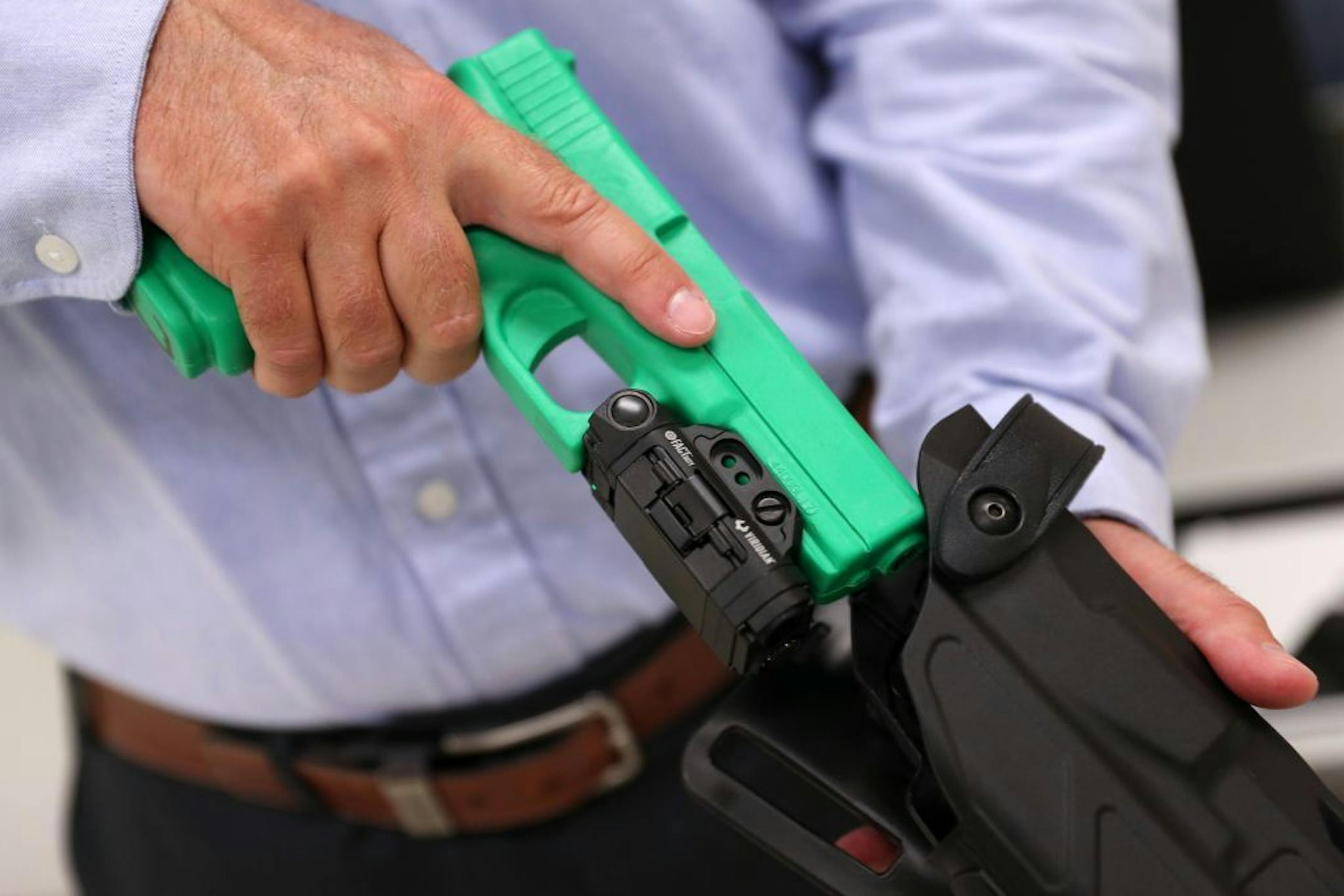 Viridian Weapon Technologies President and CEO Brian Hedeen showed the camera mounted on a police training weapon.