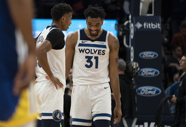 Minnesota Timberwolves guard Jarrett Culver (23) and forward Keita Bates-Diop (31 smiled after their 99-84 win over the Golden State Warriors.