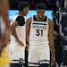 Minnesota Timberwolves guard Jarrett Culver (23) and forward Keita Bates-Diop (31 smiled after their 99-84 win over the Golden State Warriors.