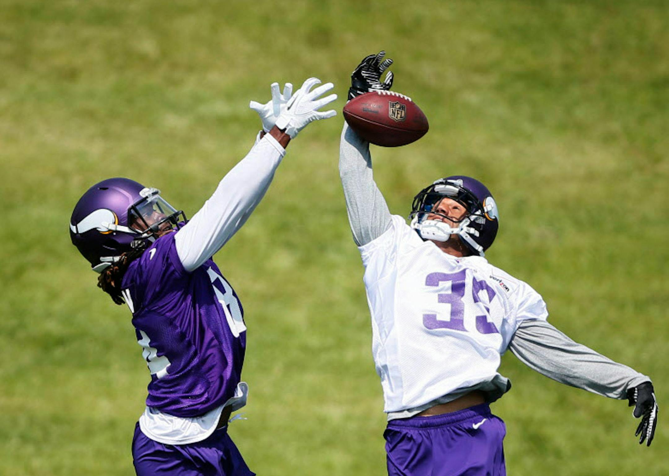 In this 2014 file photo, cornerback Marcus Sherels tipped the ball away from Cordarrelle Patterson Minnesota Vikings during OTA practice at Winter Park.
