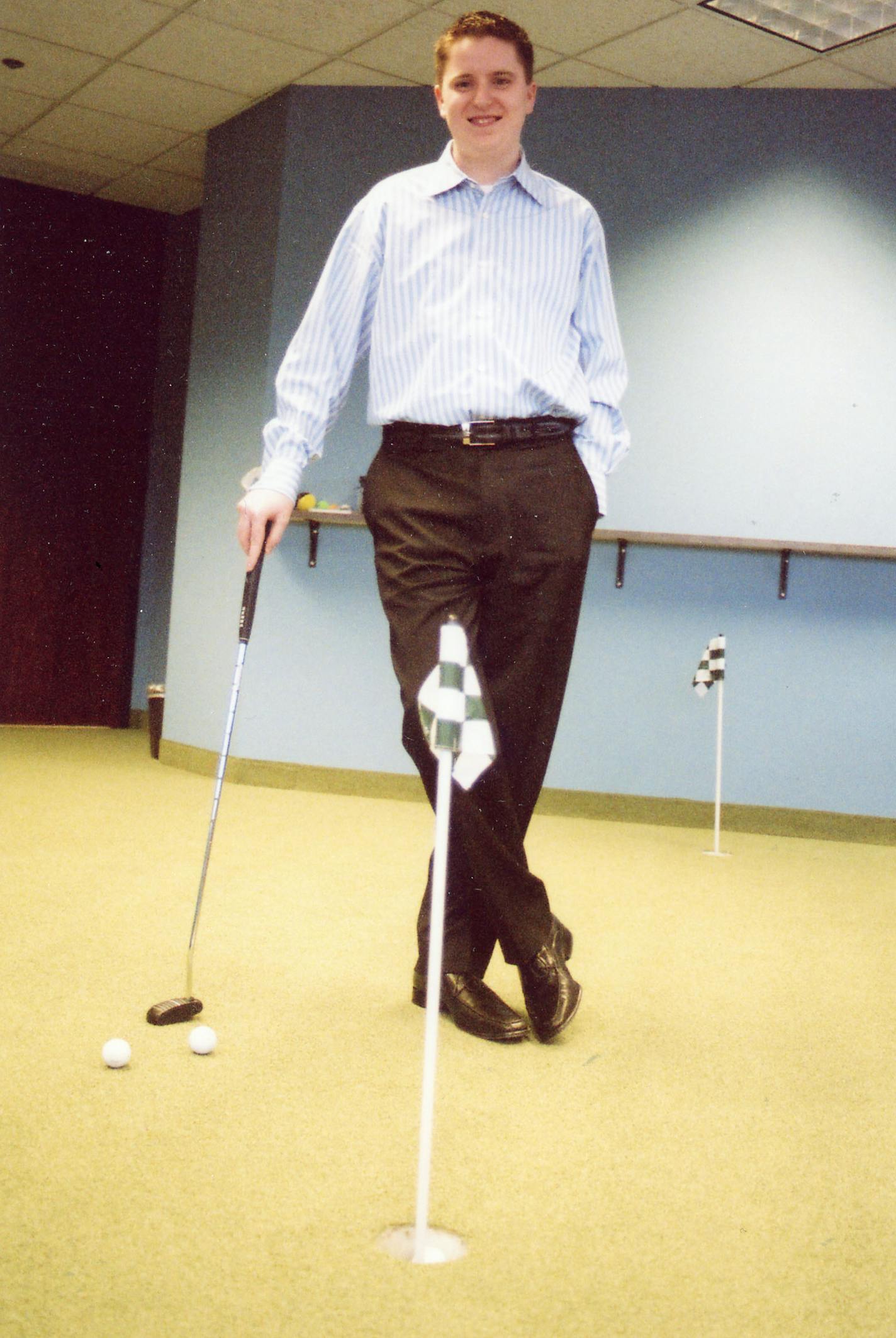 Daren Cotter, founder of CotterWeb Enterprises, has a three-hole putting green in his company's office.
