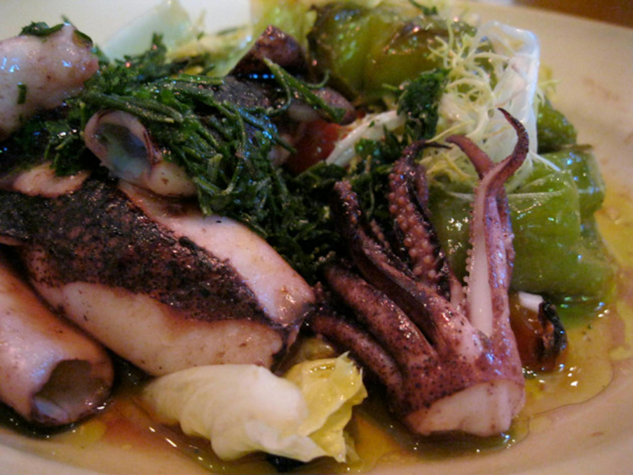 Wood-oven roasted squid and sweet peppers with escarole, and rosemary