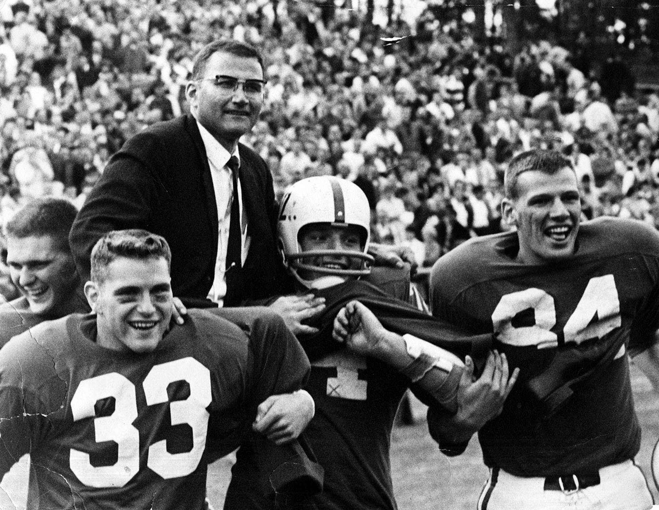 John Gagliardi got a ride off the field from his players after the Johnnies won the 1963 Division III national title.