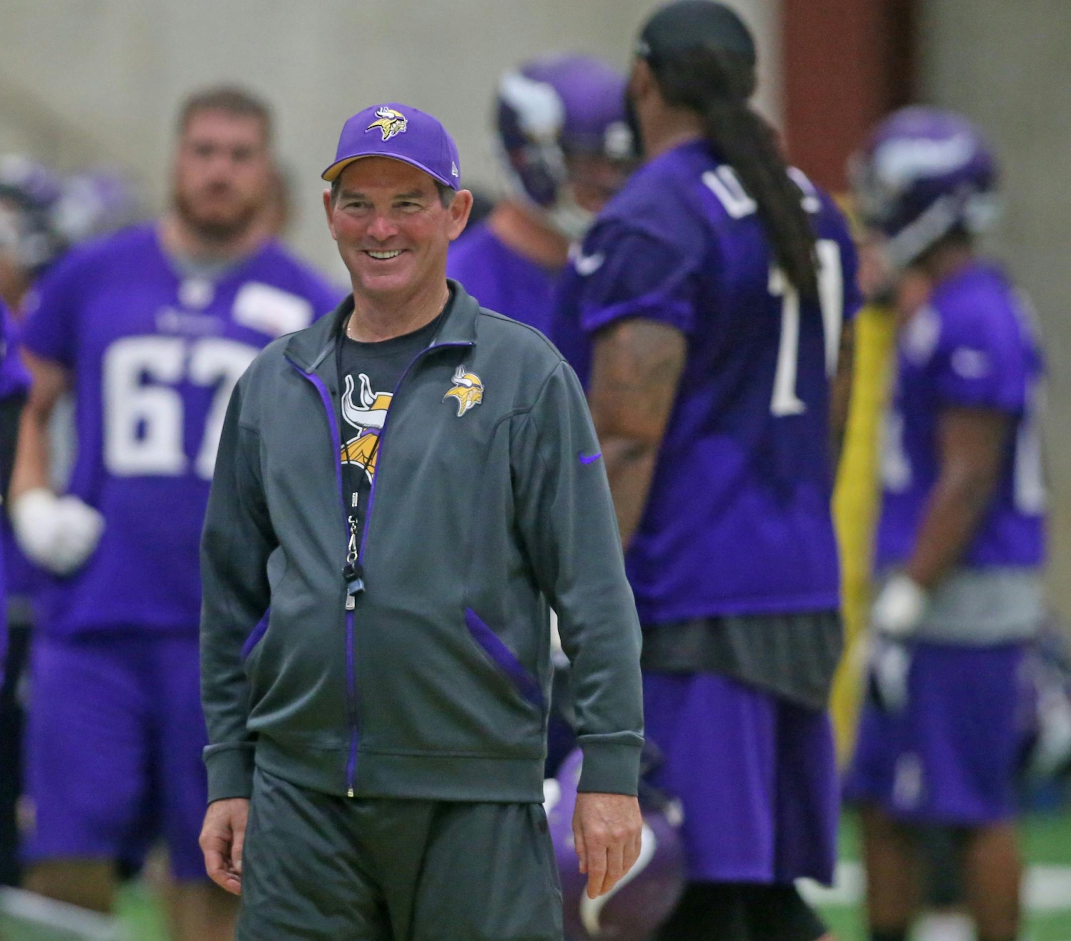 Vikings coach Mike Zimmer talked with players during minicamp practice at Winter Park on June 19.