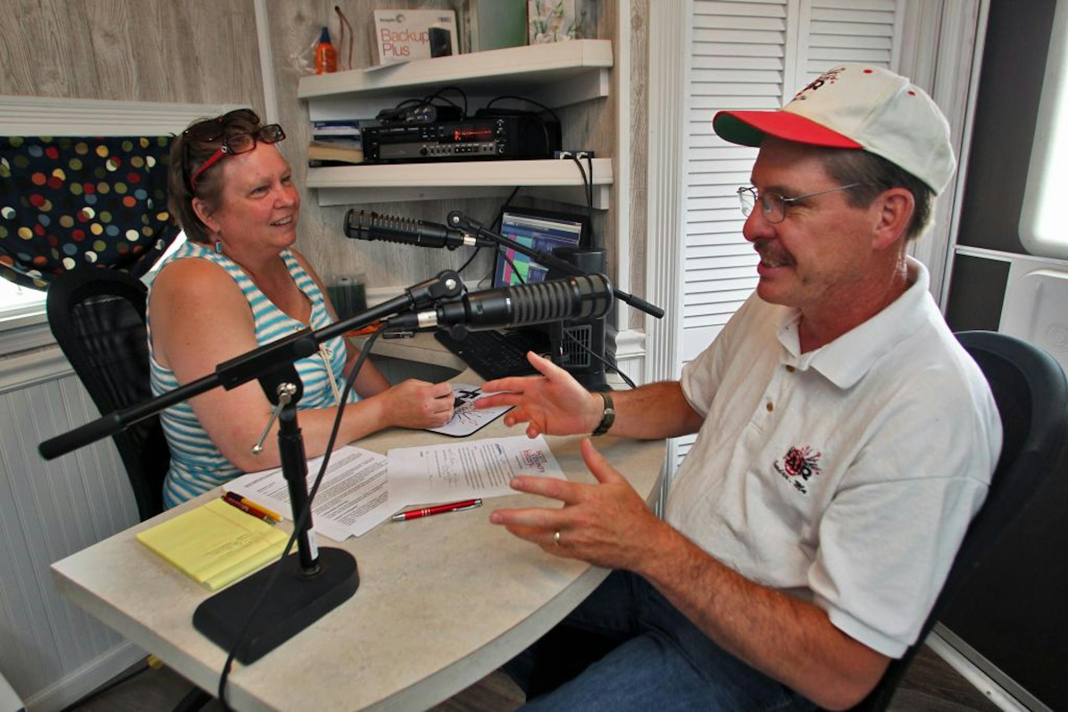 Scott county has purchased a trailer house originally designed to be an ice fishing house, but redesigned to serve as a portable house set up to gather oral histories from senior citizens. It is currently in use at the Scott County Fair in Jordan. Kathy Kiehr, director of Scott County Historical Society, left, conducted an oral history with Kevin Bailey, president of the Scott County Agricultural Society. (MARLIN LEVISON/STARTRIBUNE(mlevison@startribune.com