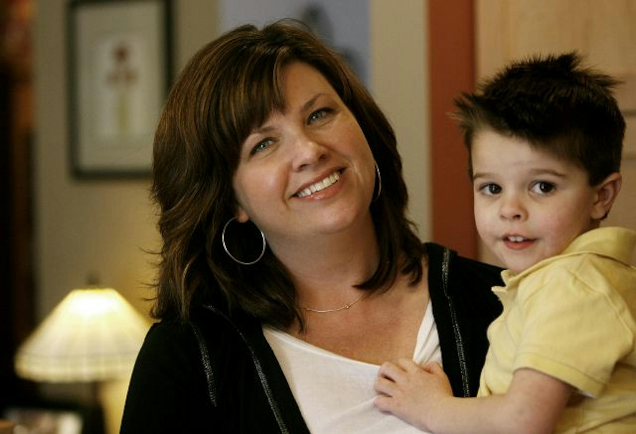 In it together: "When you do a bunch of small things, they add up," said Jennifer Wagner, shown with son Joey. The project can save families as much as $400 a year on energy without compromising lifestyles, said conservation-improvement manager Vance Zehringer.