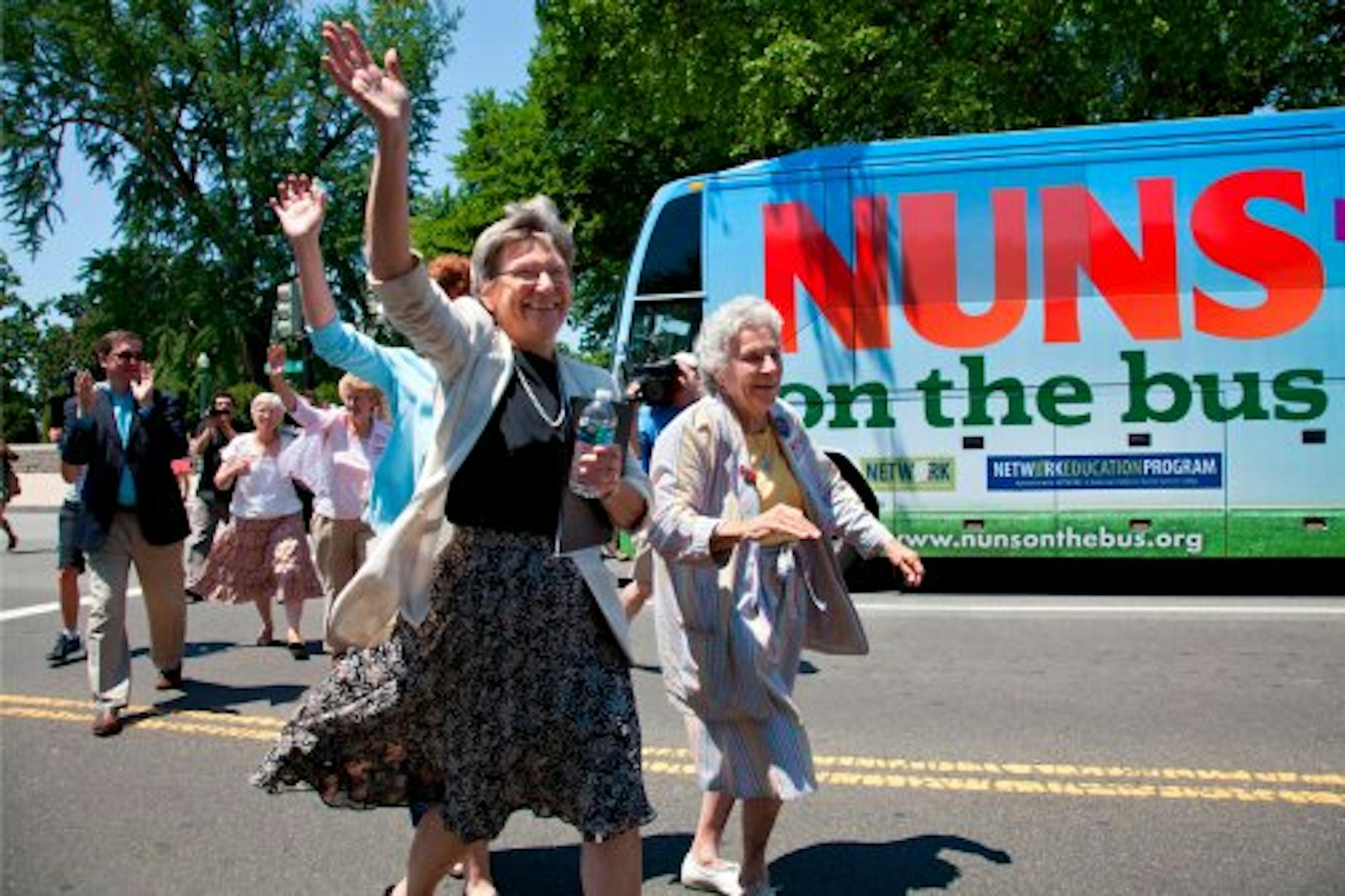 Sister Simone Campbell, left, leads a "Nuns on the bus" tour.