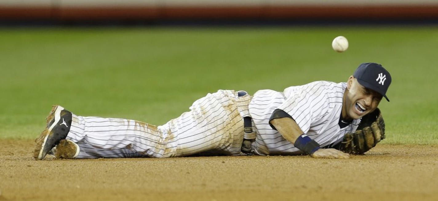 Derek Jeter reacted after fracturing his ankle in the 12th inning of Game 1 of the American League Championship Series.