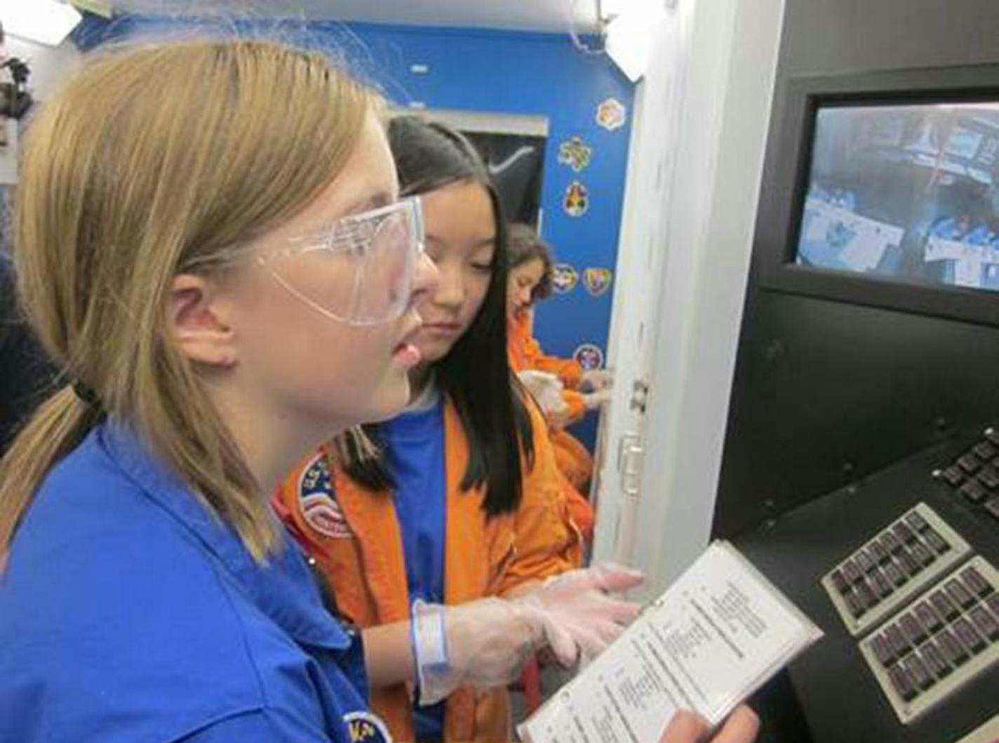 This is a photo of Abby Harrison, the South High School student who is seeking to become an astronaut . She is pictured in a simulation of an International Space Station mission at the U.S. Space and Rocket Center in Huntsville, Ala., where she has participated in Space Camp four times. Credit should go to Space Camp USA