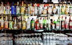 various liquor bottles at a bar. istock