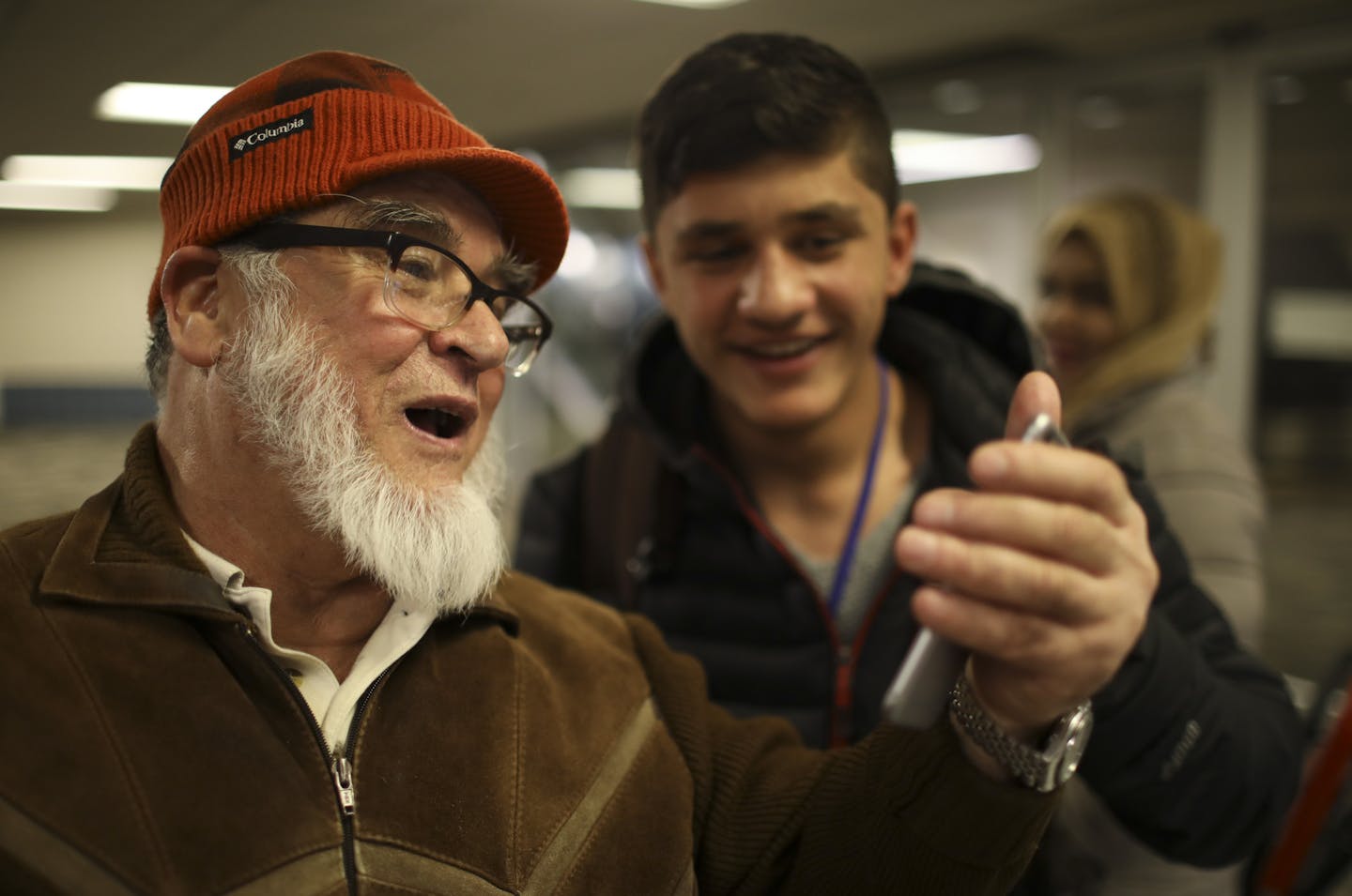 Mohammad Alini held a phone as he FaceTimed with 17-year-old Haris' grandfather back in Afghanistan so he could see that his son, Ahmad Jawid Masoumi, and his family arrived at their Minneapolis destination safely Thursday night. ] JEFF WHEELER &#xef; jeff.wheeler@startribune.com With assistance from the International Institute of Minnesota, Ahmad Jawid Masoumi, his wife, and their five children arrived in Minnesota late Thursday night, February 2, 2017 after leaving Afghanistan.