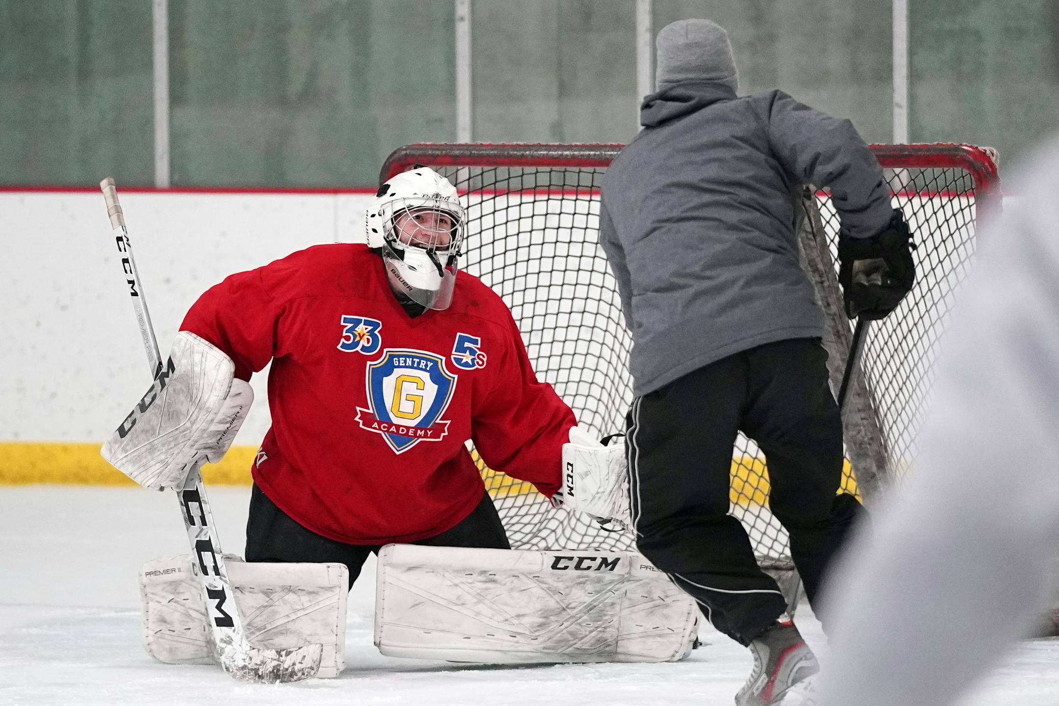 Gentry Academy hockey coach Joe Cullen tried to sneak a shot past junior goaltender Alex Timmons during practice [ANTHONY SOUFFLE • anthony.souffle@startribune.com]
