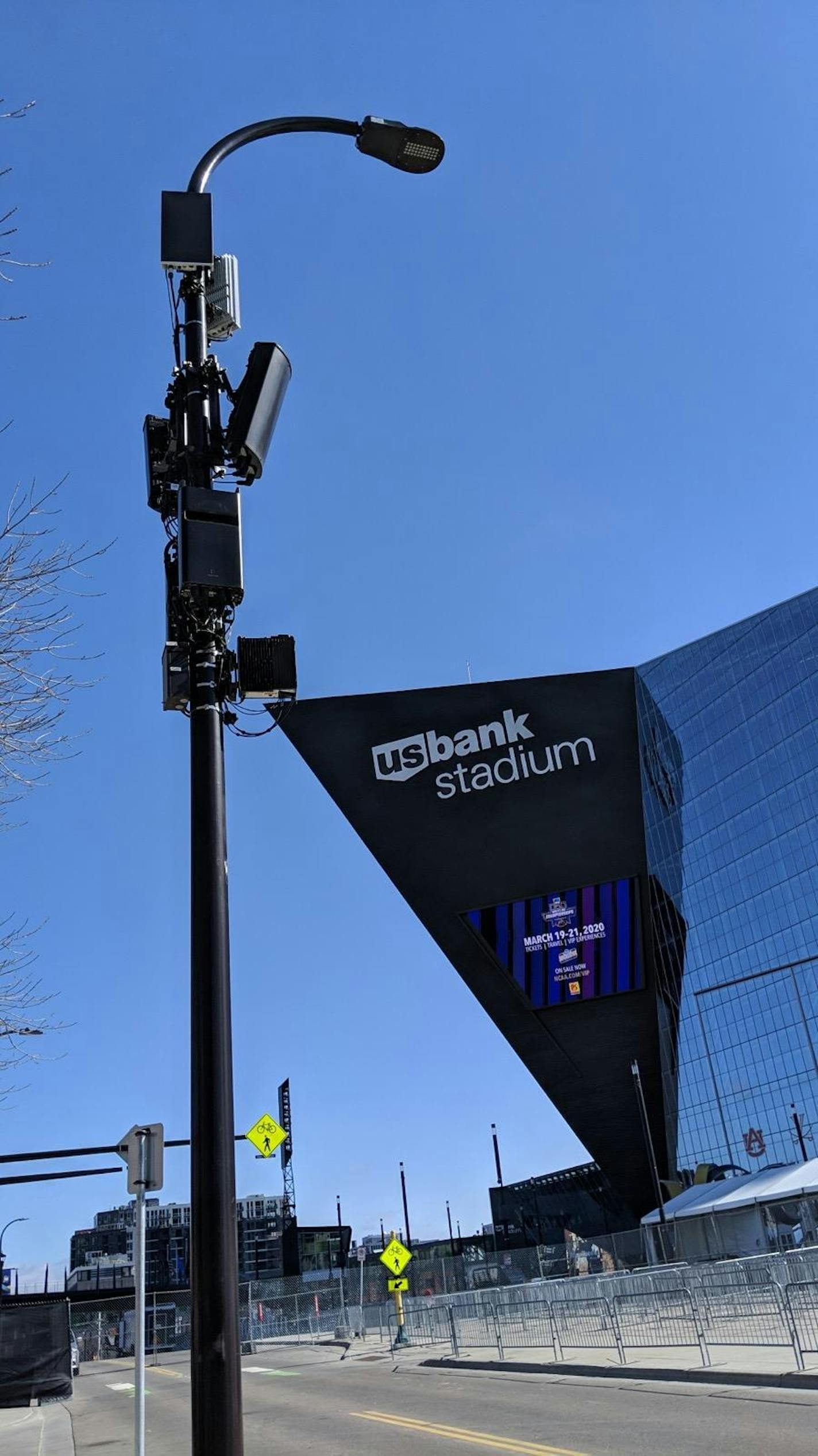 A light pole near U.S. Bank Stadium is mounted with 5G antennas, the rectangles near the top, that are for Verizon's new ultra high speed wireless service. Minneapolis and Chicago are among the first places in the world to get next-generation wireless coverage. Consumers need new phones to access it.