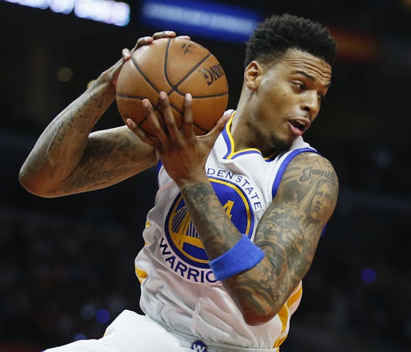 Golden State Warriors' Brandon Rush brings in a rebound against the Los Angeles Clippers during the first half of an NBA basketball game, Saturday, Fe