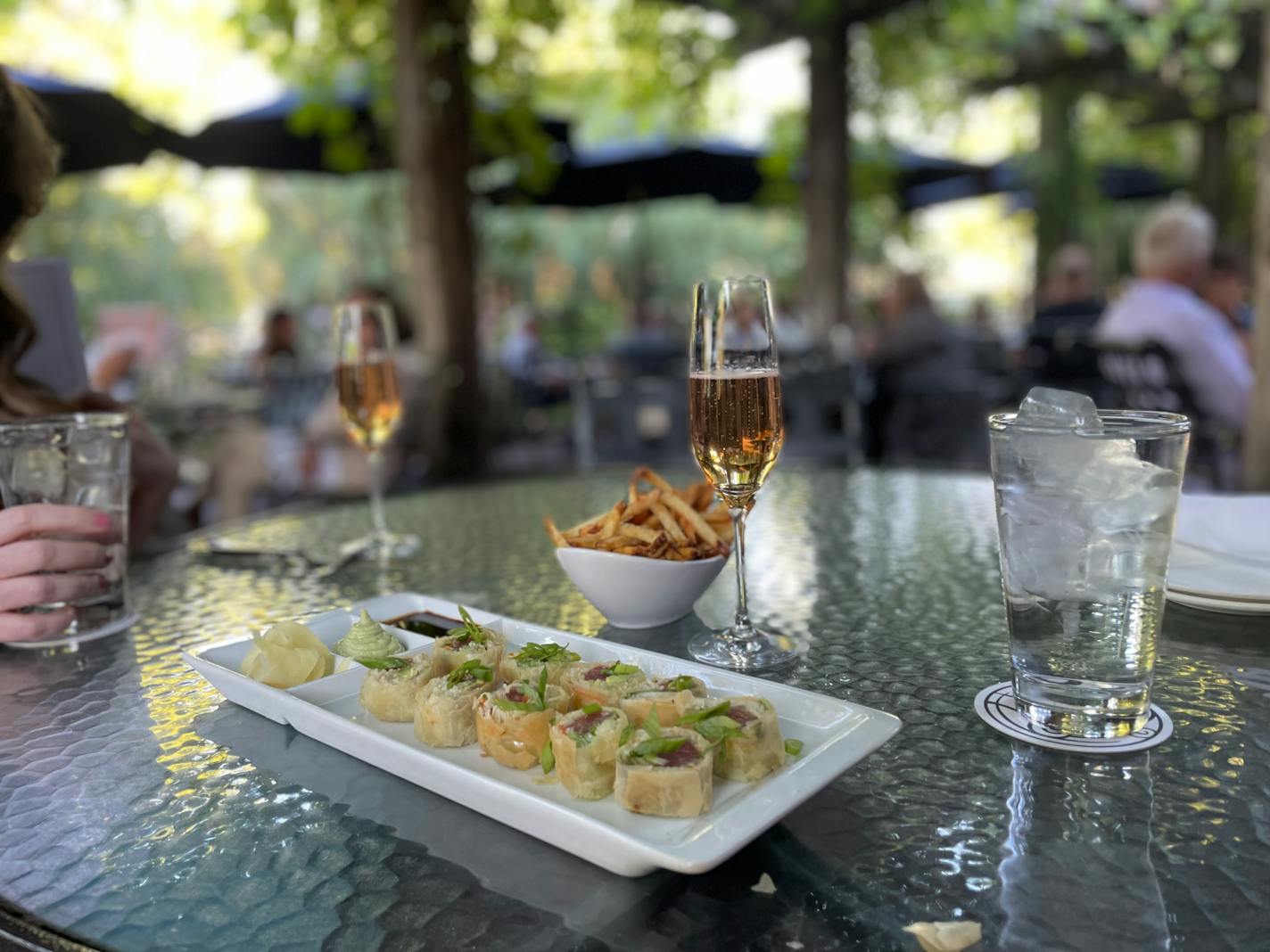 Ciao Bella patio with French fries, bubbles and tuna springrolls