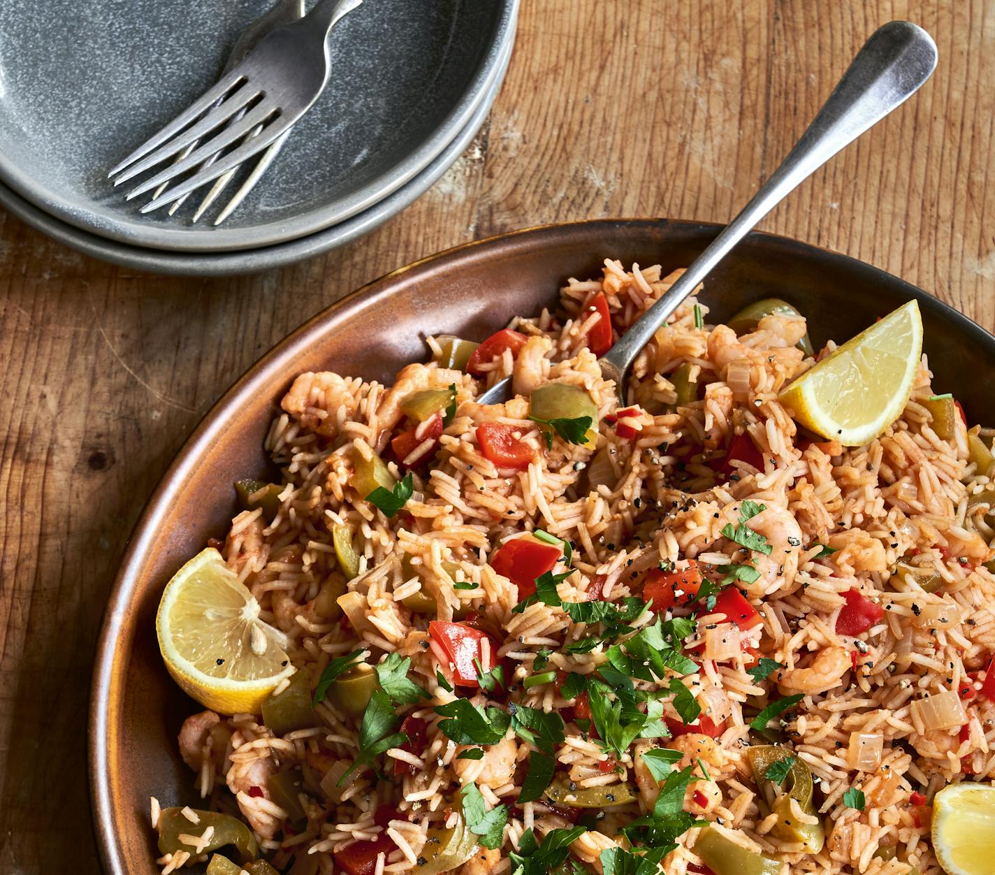 Spicy Shrimp Arroz can be made vegetarian by subbing vegetables such as mushrooms for the shrimp.Credit: Chris Terry. From "The Slimming Foodie In One," by Pip Payne (Kyle Books, 2022).