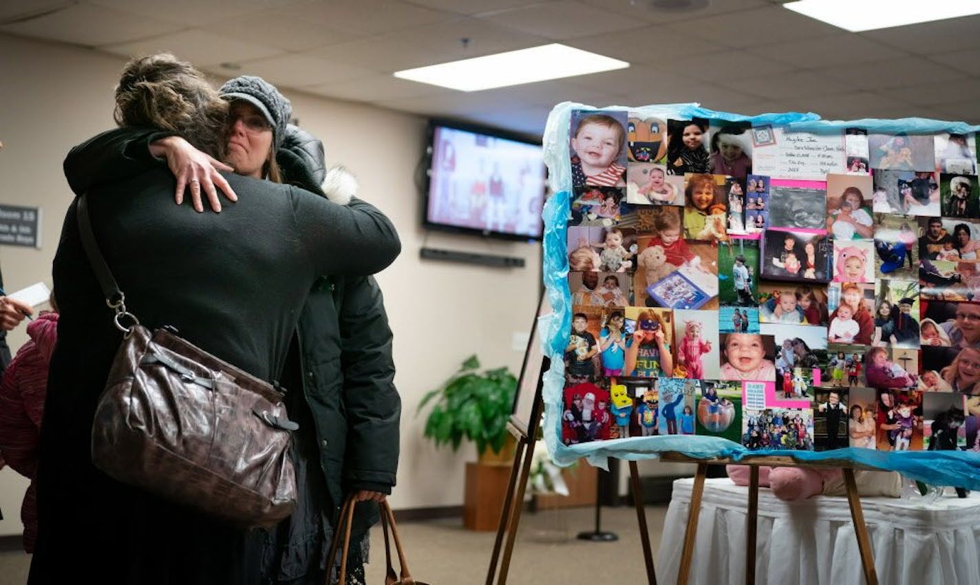 Tara Reitan, left, and Bridget Reiter hugged before going into the funeral for Haylee Hickle today in Chippewa Falls, Wis. Reitan had babysat for Haylee, and Reiter was one of her teachers.