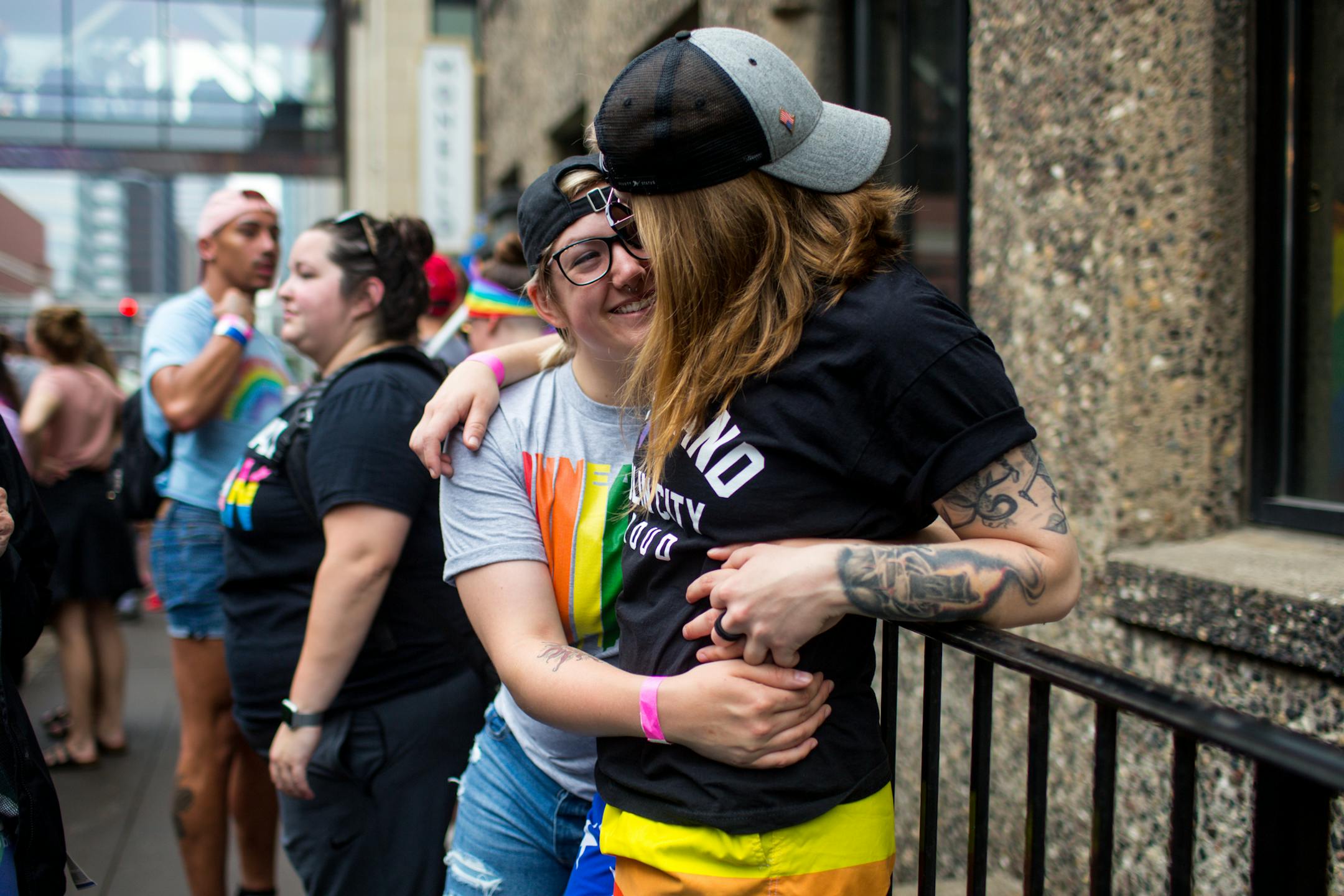 Jasmine Rognrud, 25, holds Kayley Hoaby, 23, on the outskirts of the parade. ] NICOLE NERI ¥ nicole.neri@startribune.com BACKGROUND INFORMATION: Sunday June 23, 2019 at the Minneapolis Pride Parade, starting at 2nd Avenue and 3rd Street and ending at Loring Park.