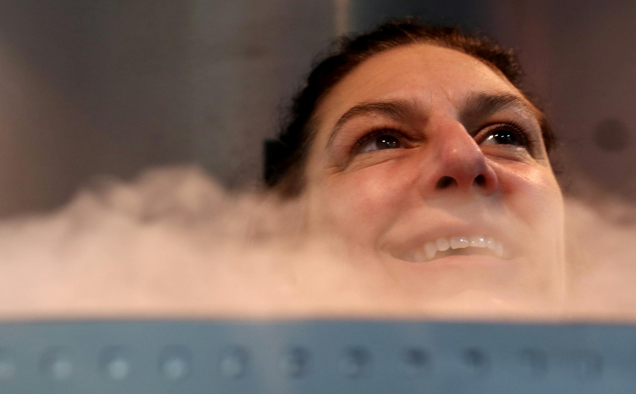 Michelle Chaput stood for her three minute treatment in the cryosauna and chatted with owner of The Locker, Branden Johnson. Chaput gets treatment for her rheumatoid arthritis. She said she was able to stop taking her medication since doing these treatments. ] (KYNDELL HARKNESS/STAR TRIBUNE) kyndell.harkness@startribune.com At The Locker in Minneapolis Min., Wednesday November 11, 2015. People getting their dose of cryotherapy - a trendy new treatment for sore muscles, rejuvenation, etc.