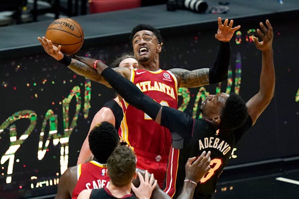 Atlanta Hawks forward John Collins, center top, is reportedly coveted by the Timberwolves.