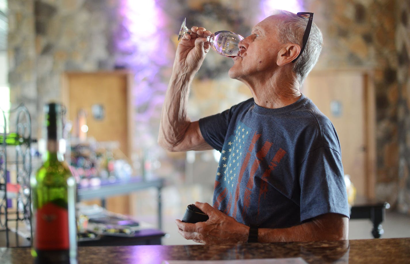 John Seward, of Fridley, sampled a Chisago Grape wine: the "deergarden red" at Winehaven Winery in the Chisago Lakes Area, Minn., on Friday June 19, 2015. The Chisago Lakes Area is made up of Chisago City, Lindstrom, Scandia, Center City, Shafer, Taylors Falls and Almelund. ] RACHEL WOOLF &#x2022; rachel.woolf@startribune.com