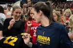 Indiana Fever guard Caitlin Clark signs autographs for fans before Sunday's game at Target Center.



The Minnesota Lynx hosted the Indiana Fever In a