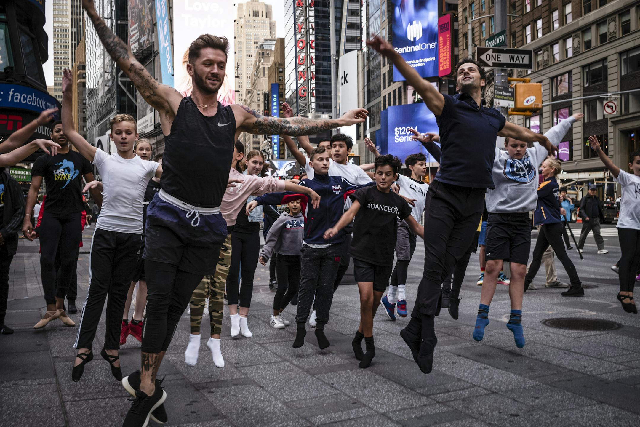 Travis Wall, left, and Robbie Fairchild lead a class for dancers near the studios of &#x201c;Good Morning America&#x201d; in Times Square, after Lara Spencer made comments about boys who dance ballet, in New York, on Monday morning, Aug. 26, 2019. Spencer apologized for the comments she made last week in an extended segment Monday on &#x201c;Good Morning America,&#x201d; during which she acknowledged that her remarks had been insensitive and said that she had learned from them. (Misha Friedman/T
