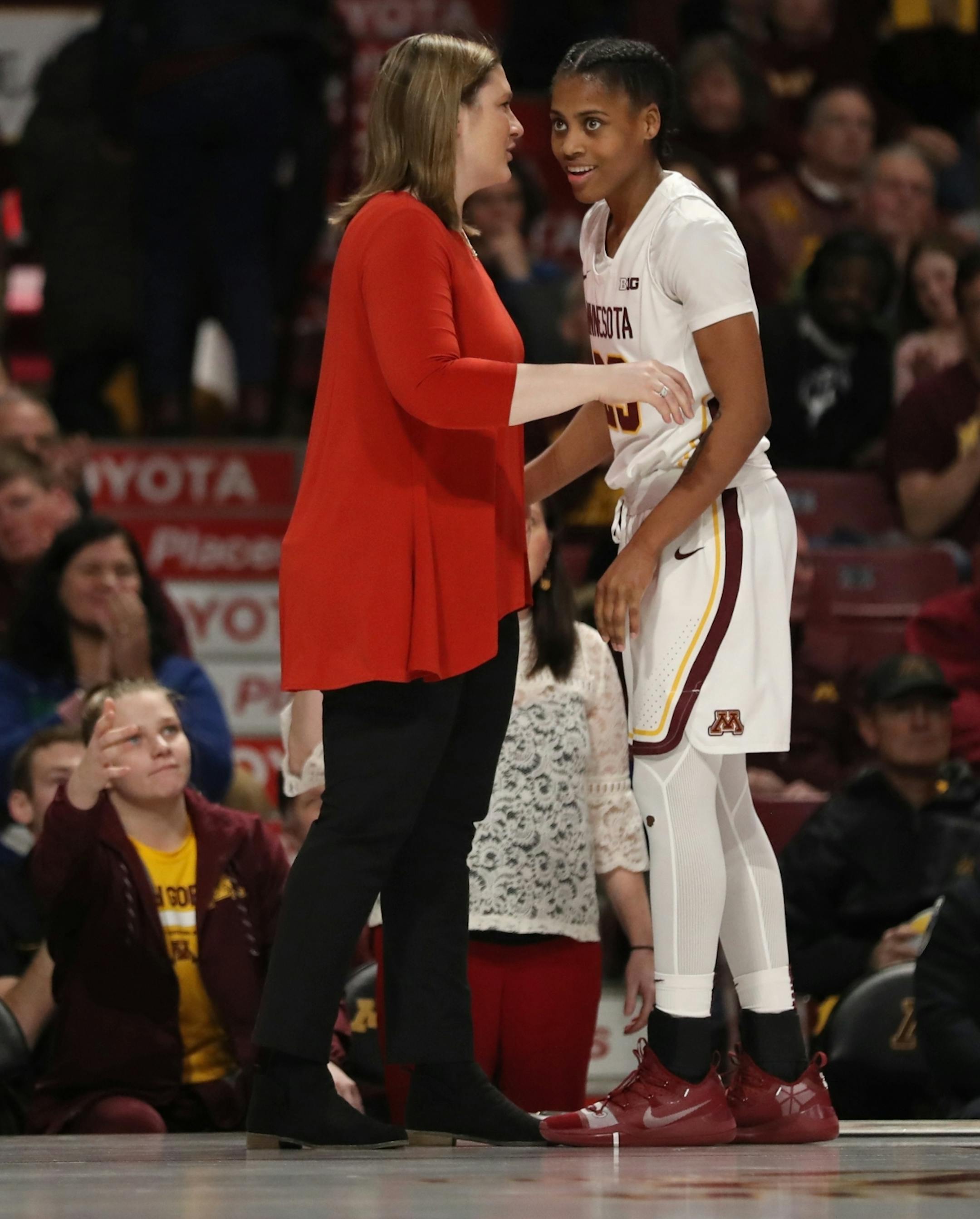 Gophers head coach Lindsay Whalen spoke with guard Kenisha Bell (23) near the end of the game. Bell led all scorers with 28 points.