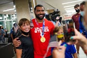 Gable Steveson, gold medal wrestler, takes a photo with fans after arriving at Minneapolis-Saint Paul International Airport on Sunday, August 8, 2021,