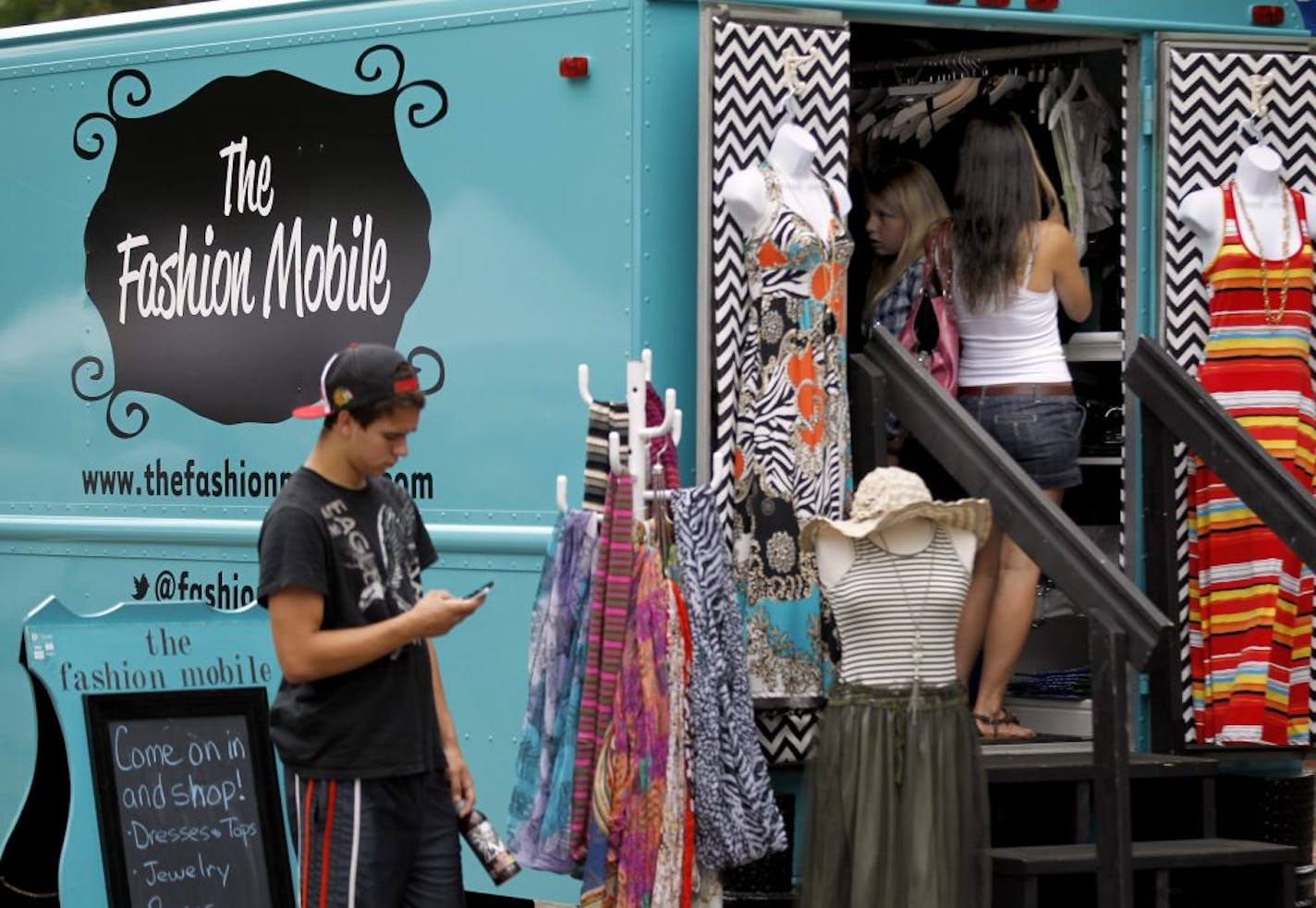 Shoppers looked through the Fashion Mobile during Marketfest in White Bear Lake.