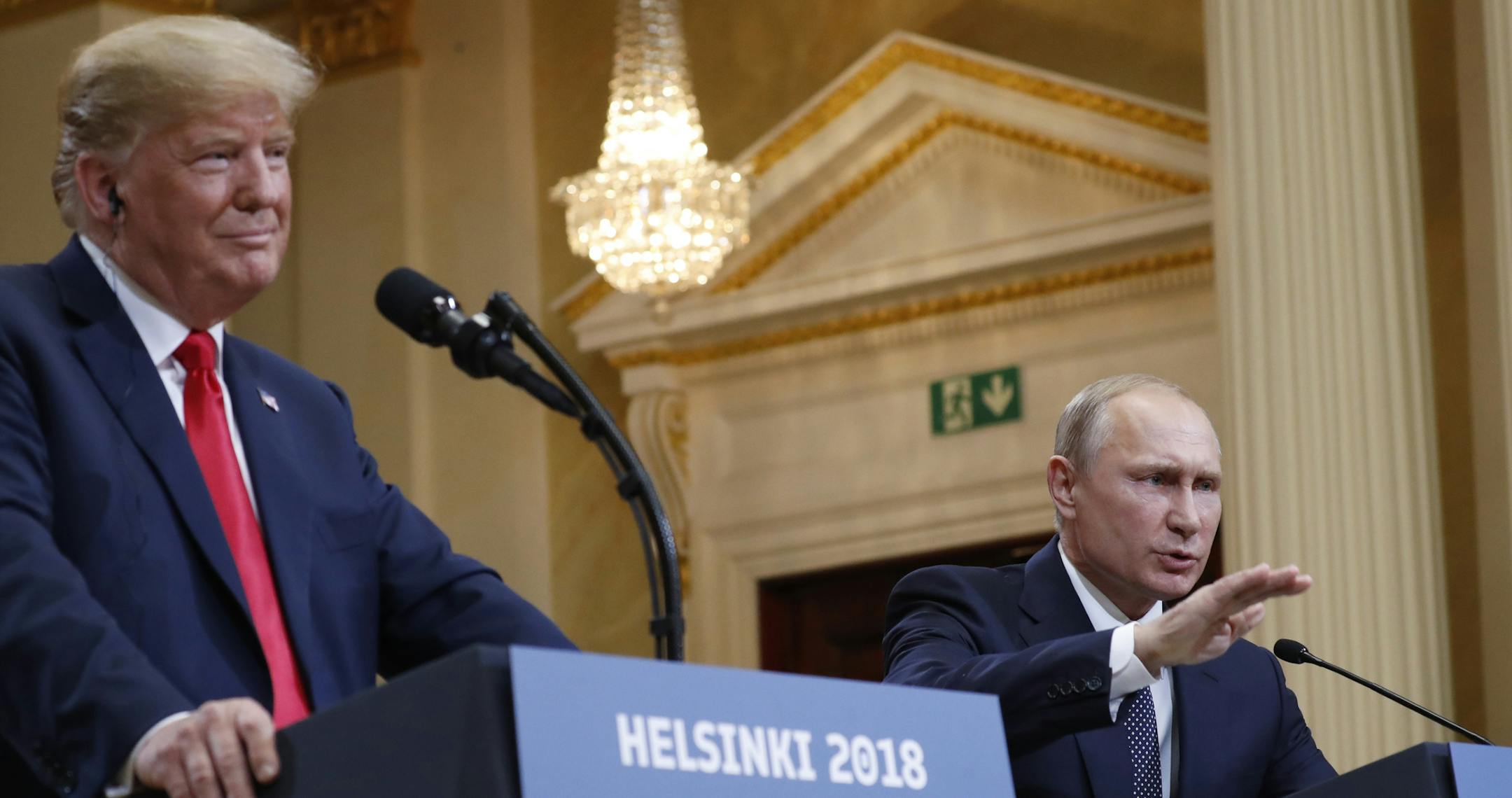 U.S. President Donald Trump, left, listens to Russian President Vladimir Putin during a press conference after their meeting at the Presidential Palace in Helsinki, Finland, Monday, July 16, 2018. (AP Photo/Pablo Martinez Monsivais)