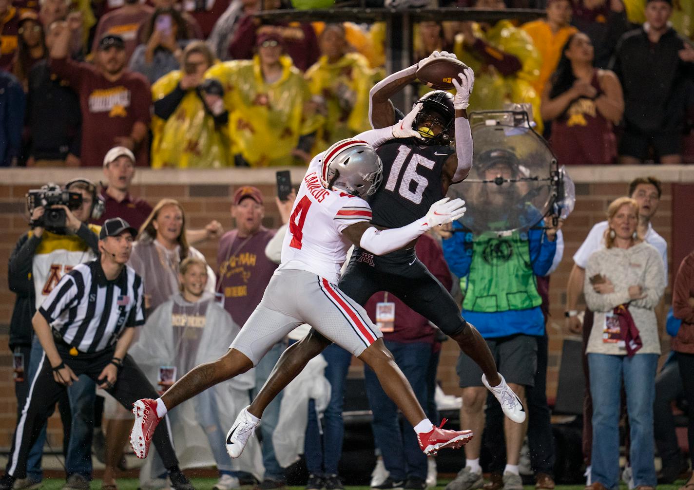 Gophers wide receiver Dylan Wright caught a 13 -yard touchdown pass in the second quarter as he was defended by Ohio State cornerback Lejond Cavazos