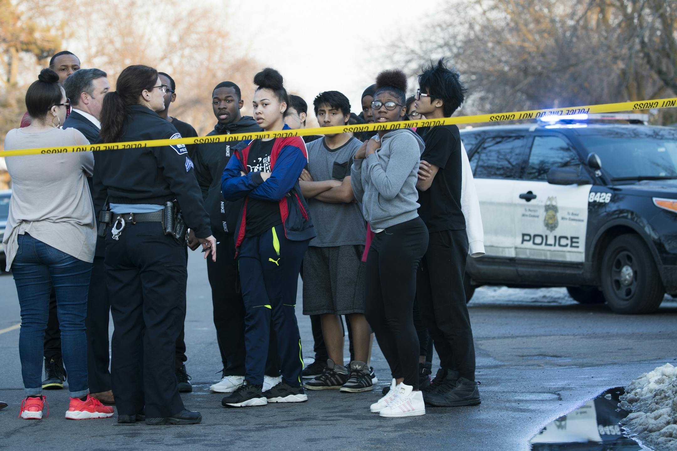 A group of students is evacuated from the school.