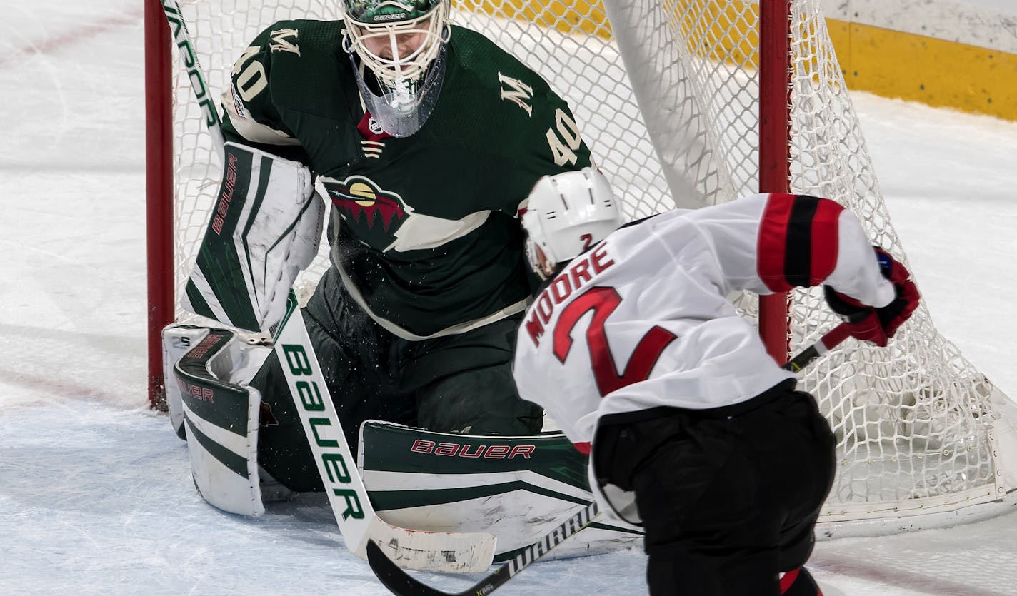 John Moore (2) shot the puck past Wild goalie Devan Dubnyk (40) to win the game in overtime. ] CARLOS GONZALEZ &#xef; cgonzalez@startribune.com - November 20, 2017, St. Paul, MN, Xcel Energy Center, NHL, Hockey, Minnesota Wild vs. New Jersey Devils