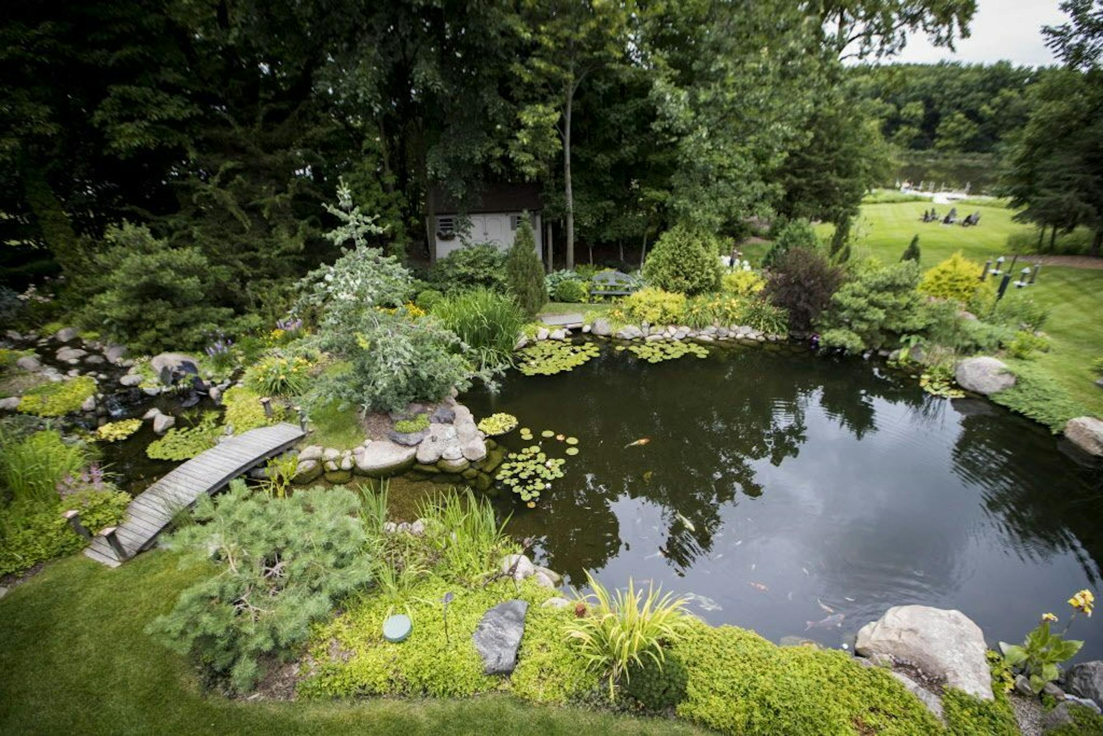 The garden includes a large and lushly landscaped koi pond.