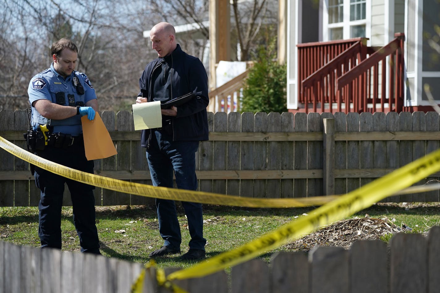 Police recovered a cell phone from nearby the scene of a homicide Saturday in the 1100 block of Irving Avenue North. ] ANTHONY SOUFFLE &#x2022; anthony.souffle@startribune.com Police investigated the scene of a homicide Saturday, April 18, 2020 in the 1100 block of Irving Avenue North in Minneapolis.