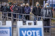 Voters stood in a cold wind Friday to cast their early ballots at the Elections & Voter Services offices in Minneapolis.