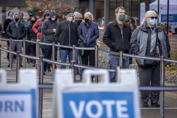 Voters stood in a cold wind Friday to cast their early ballots at the Elections & Voter Services offices in Minneapolis.