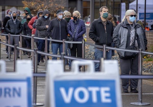 Voters stood in a cold wind Friday to cast their early ballots at the Elections & Voter Services offices in Minneapolis.