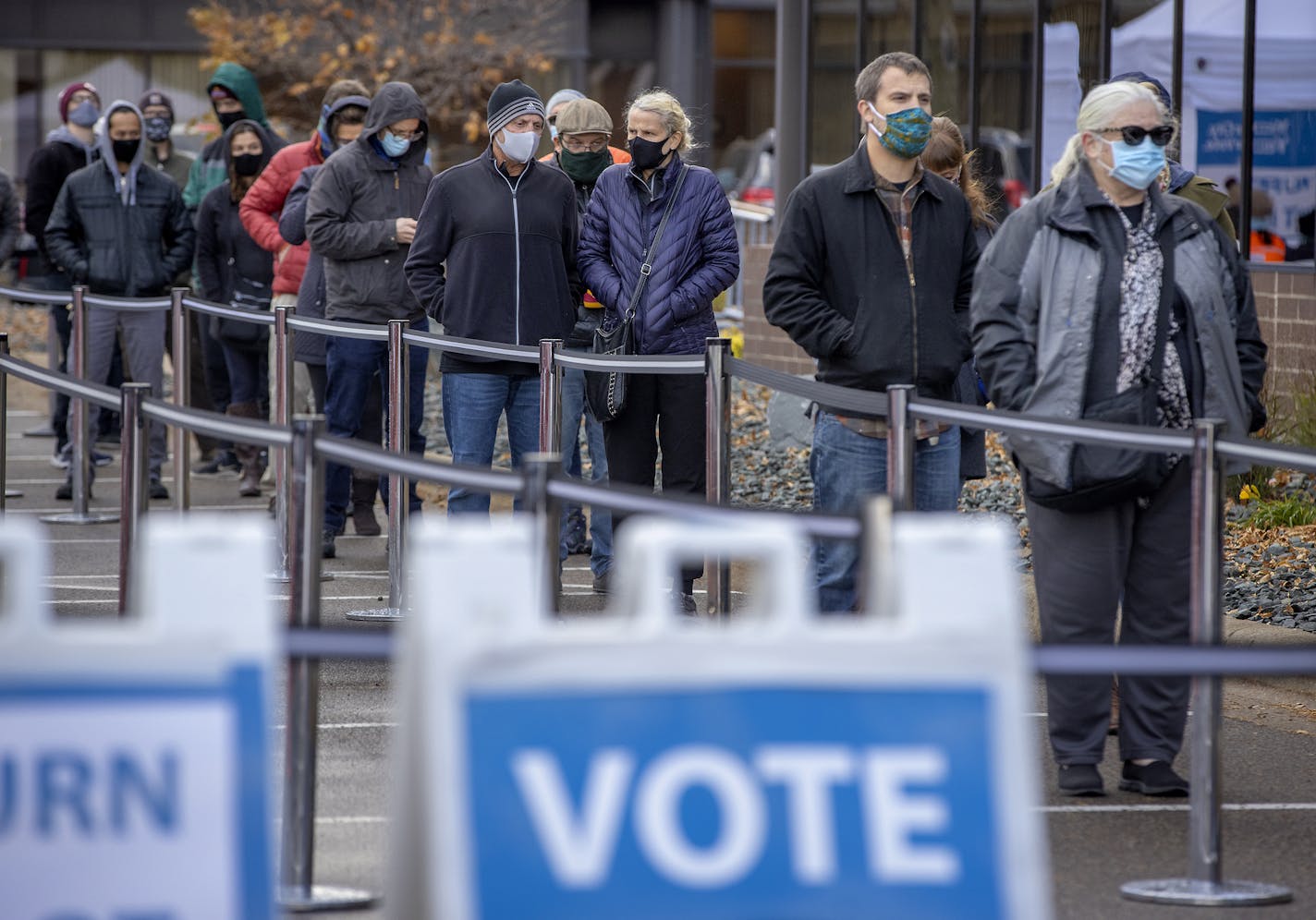 Voters stood in a cold wind Friday to cast their early ballots at the Elections & Voter Services offices in Minneapolis.