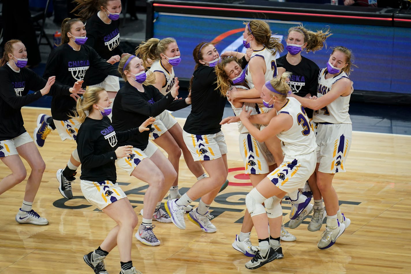 Chaska teammates celebrated their 45-43 win against Rosemount.