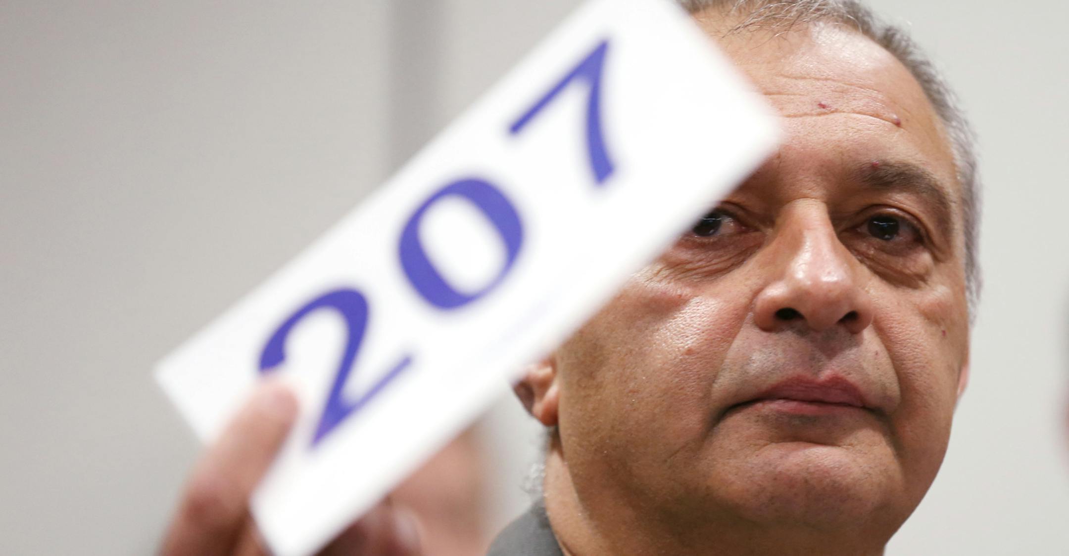 David Olshansky bids on a property during the Hennepin County tax-forfeited land auction at the Hennepin County Government Center in Minneapolis on Friday, May 1, 2015. ] LEILA NAVIDI leila.navidi@startribune.com /