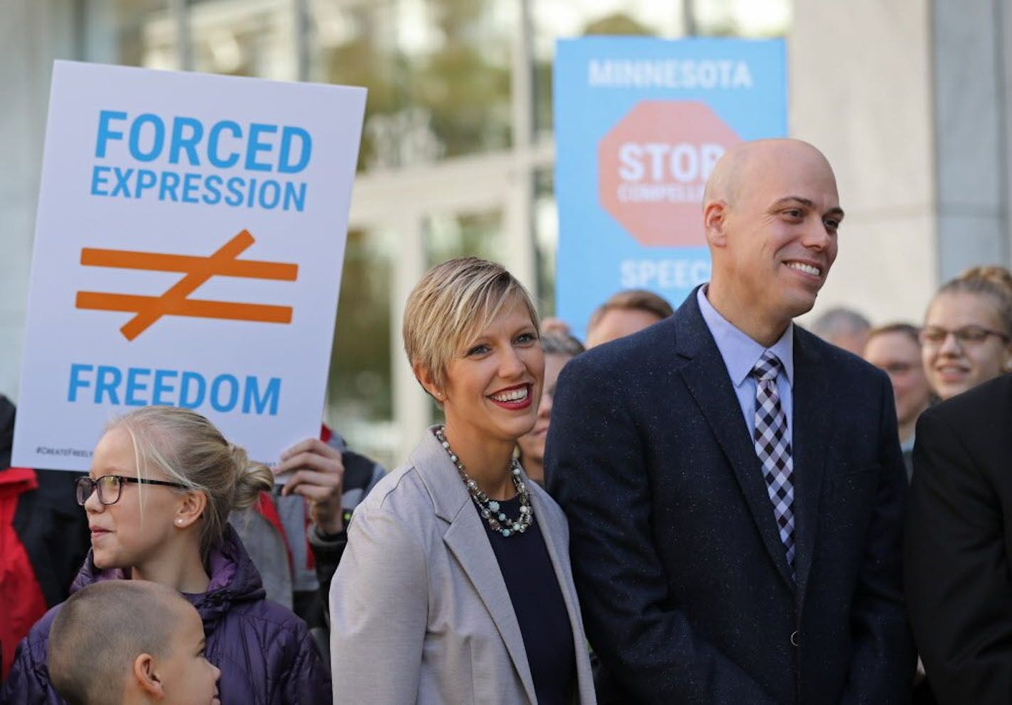 Angel and Carl Larsen, owners and founders of Telescope Media Group, stand in front of family and friends outside the Federal Courthouse in Saint Paul on Tuesday, October 16, 2018.