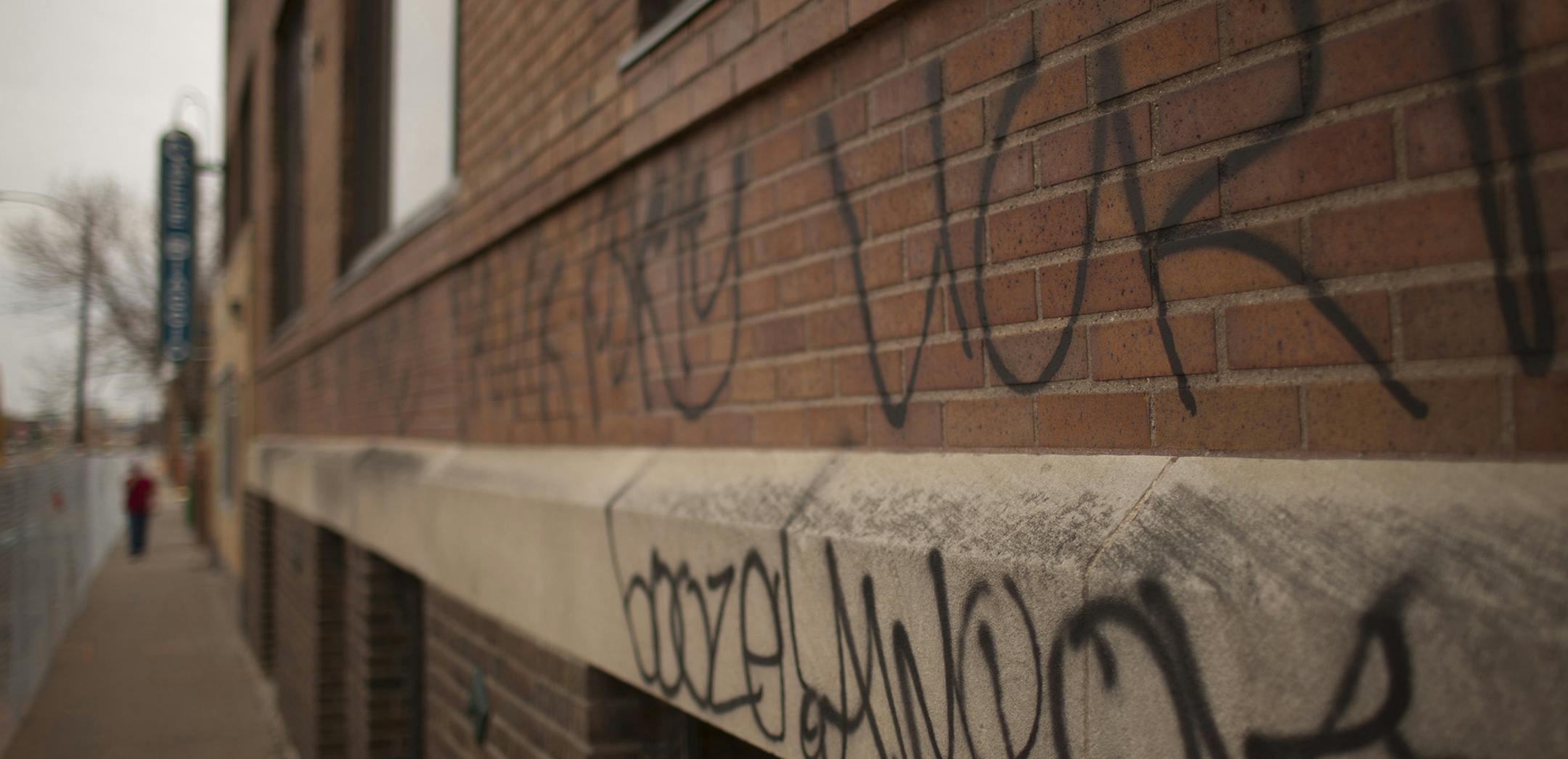 JEFF WHEELER ï jeff.wheeler@startribune.com ST. PAUL - 4/25/11 - Many buildings on University Ave. in St. Paul were spray painted with graffiti. The vandals hit buildings on the south side of University Ave. between Raymond and Snelling Aves. IN THIS PHOTO: ] Graffiti on the Specialty Building on University Ave. at Raymond Ave. in St. Paul Monday afternoon. ORG XMIT: MIN2016121614224219
