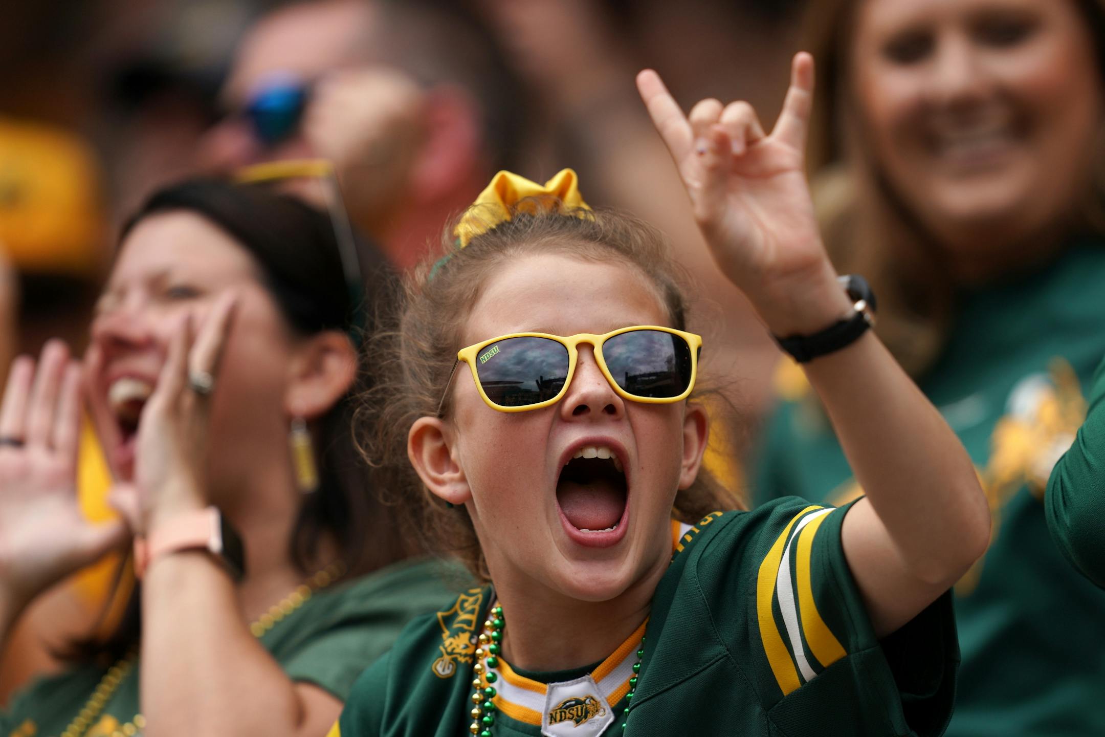 A young North Dakota State Bison fan celebrated after tight end Josh Babicz (81) caught a touchdown pass in the first half.