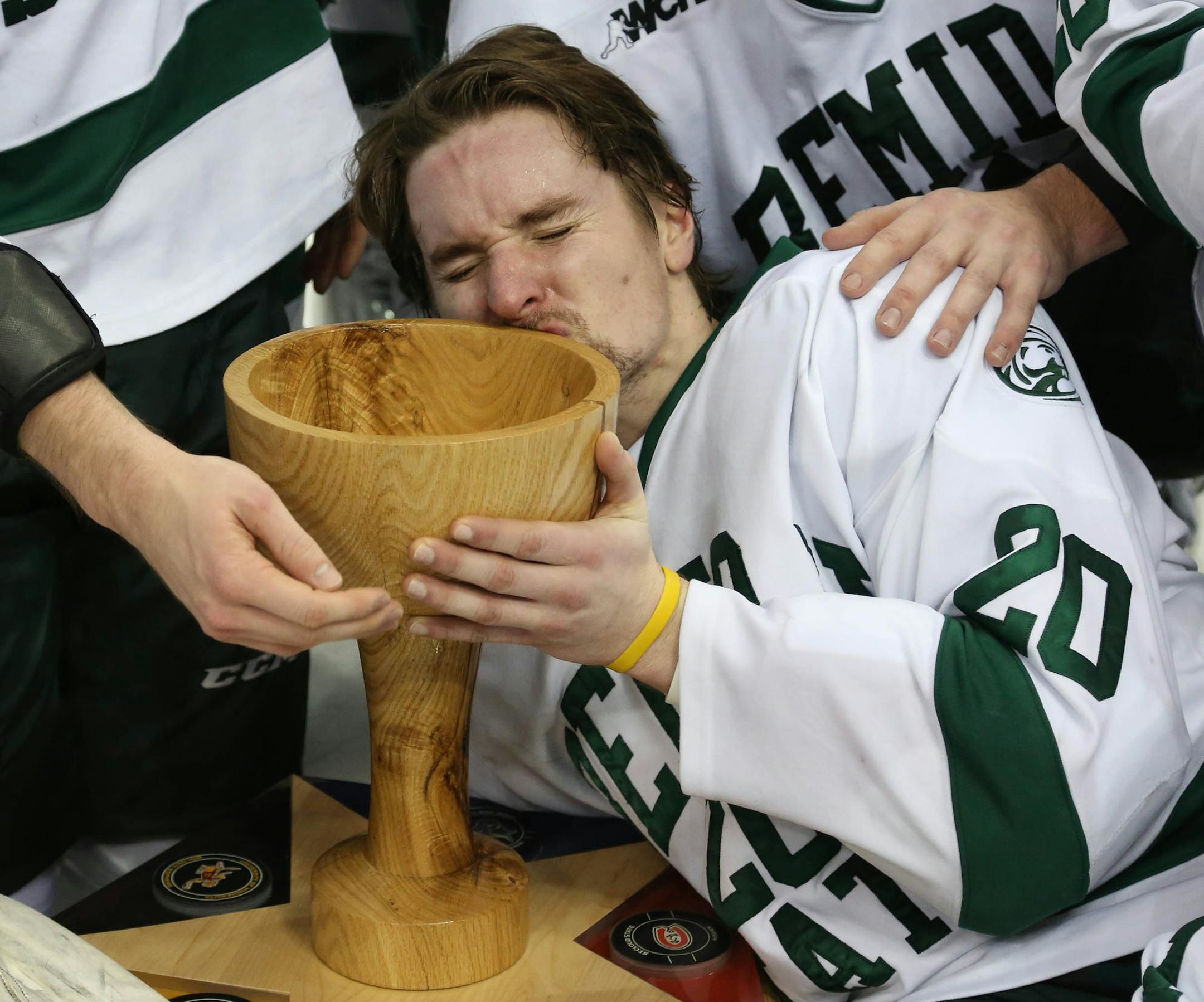 Bemidji State's Sam Rendle kissed the cup after their win over Minnesota State. ] (KYNDELL HARKNESS/STAR TRIBUNE) kyndell.harkness@startribune.com Bemidji State vs Minnesota State during the North Start College Cup finals at the Xcel Energy Center in St. Paul Min., Saturday, January 24, 2015. Bemidji State won over Minnesota State 3-1.