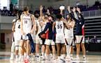 Players from the Gonzaga Bulldogs react after defeating the Kansas Jayhawks during the Rocket Mortgage Fort Myers Tip-Off at Suncoast Credit Union Are